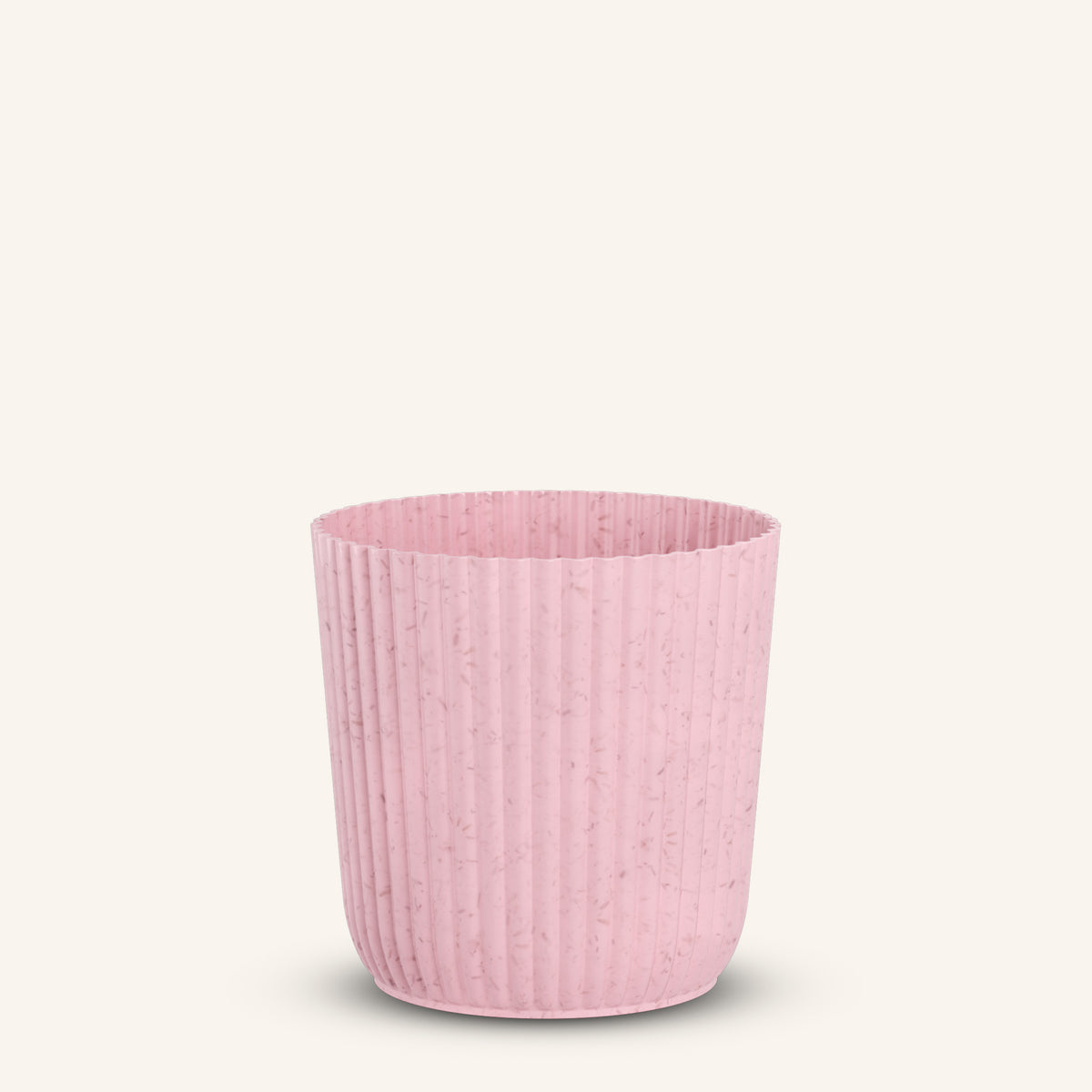 Pink ribbed plant pot with speckled texture, empty