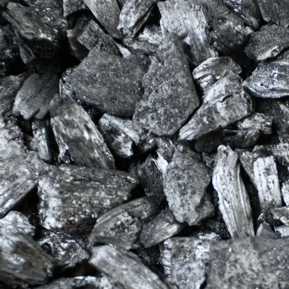 Close-up of black charcoal or biochar chunks, biochar buy