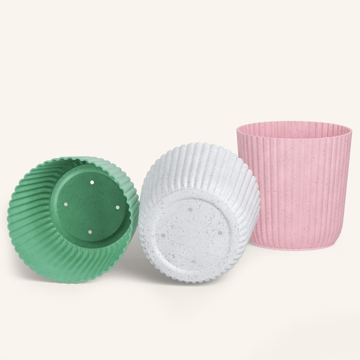 Three ribbed plant pots in green, white, and pink, sunbeam - biobased plant pots